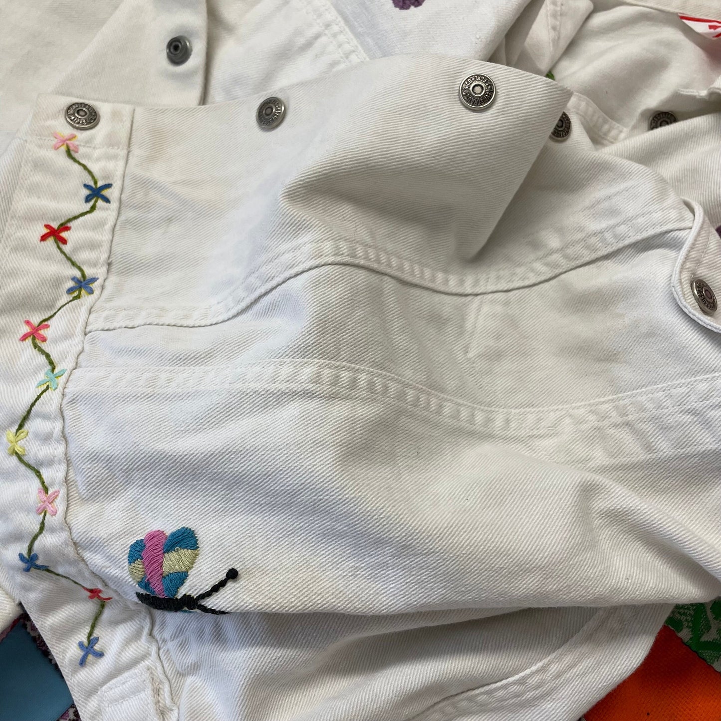 vtg levi's FLORAL EMBROIDERED white jean jacket ꕤ ꕤ flowers and bugs nudie suit sweetheart rodeo country rock western ranch wear parsons