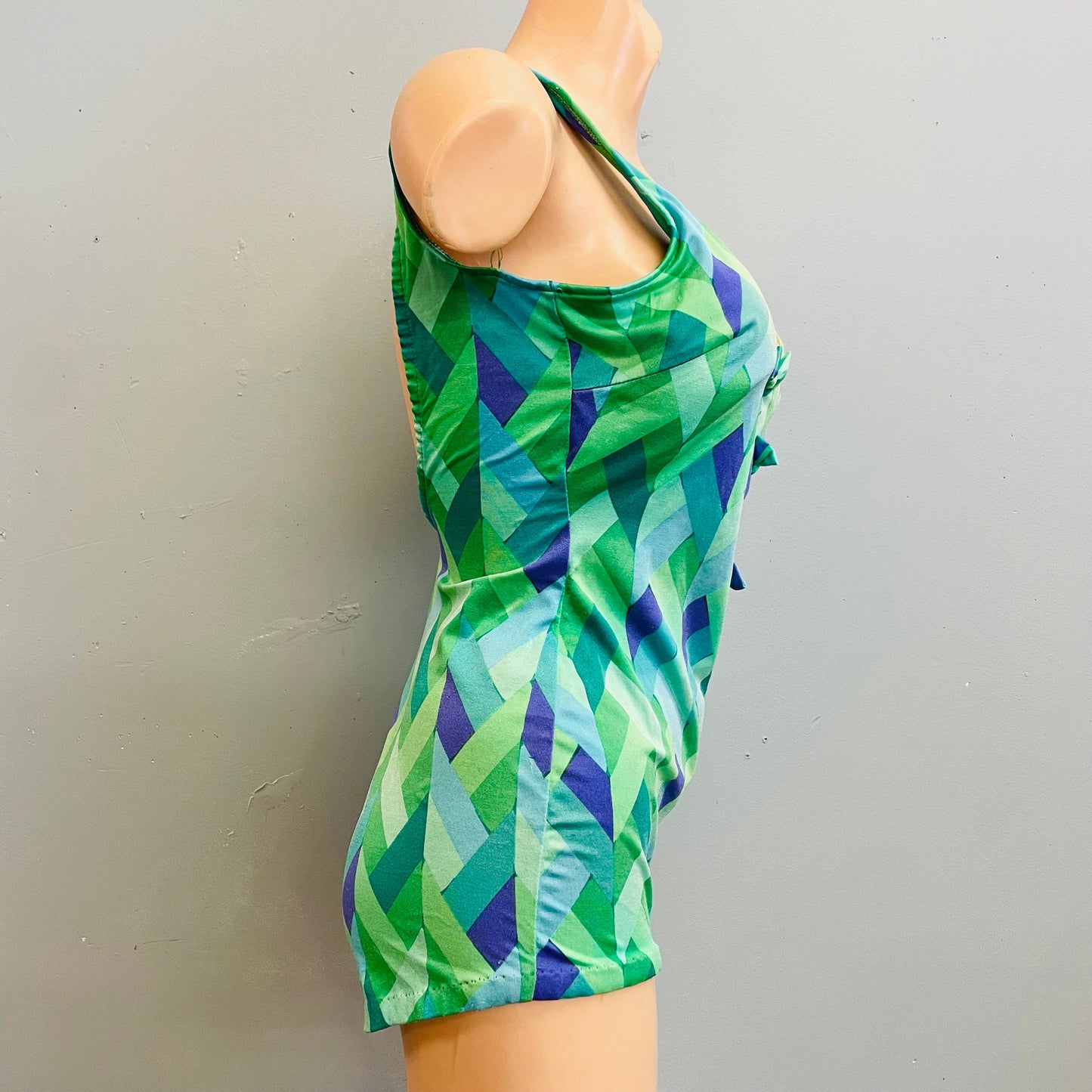 Vintage 70s psychedelic geometric print cut out swimsuit mod retro low cut boy short one piece bathing suit bright green blue bow ties