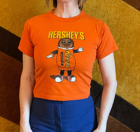 vtg 90s REESES PEANUT BUTTER Cups anthropomorphic candy orange & yellow happy face smiley guy baby tee youth large crop top funny Halloween