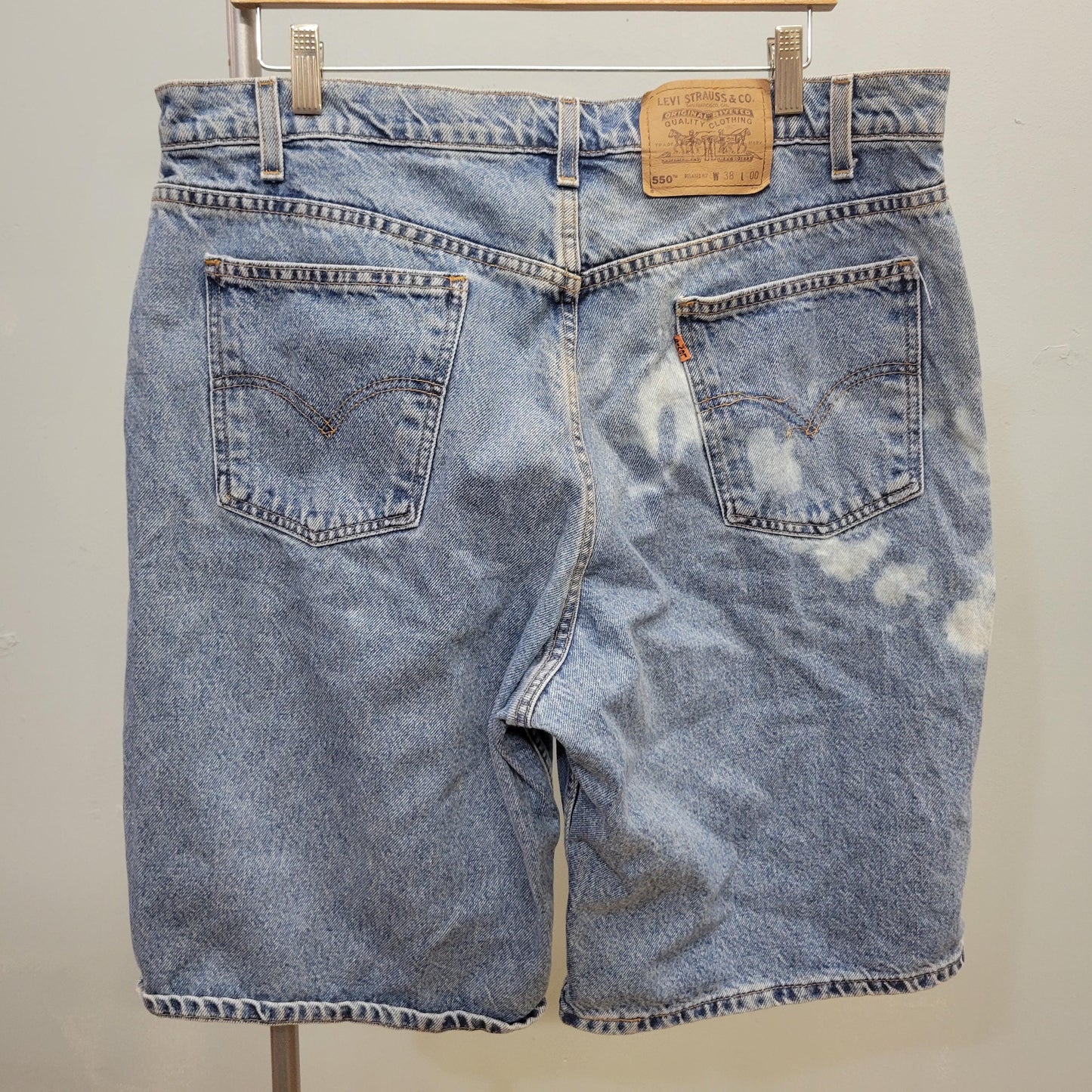 vtg 80s LEVIS 550 DENIM SHORTS 38" // vintage bleached light medium stone washed denim jorts bleach splatter loose distressed long denim