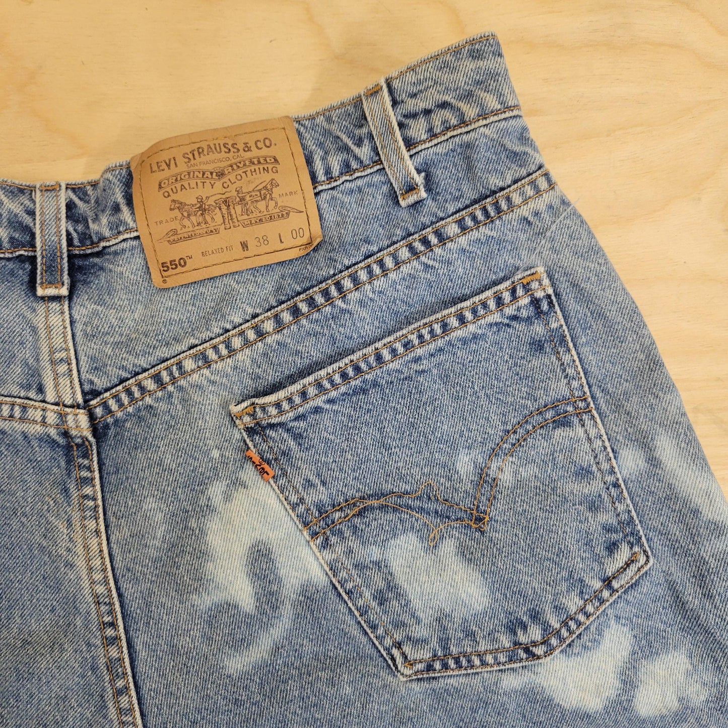 vtg 80s LEVIS 550 DENIM SHORTS 38" // vintage bleached light medium stone washed denim jorts bleach splatter loose distressed long denim