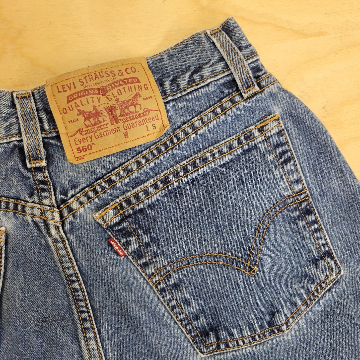 vtg 80s LEVI DENIM SHORTS // vintage 560 red tag regular loose fit jorts light medium stone wash paper tag denim jeans preppy casual