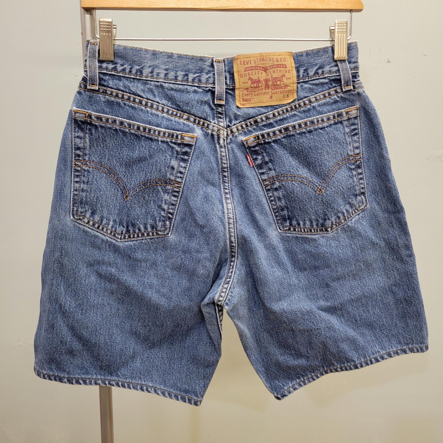 vtg 80s LEVI DENIM SHORTS // vintage 560 red tag regular loose fit jorts light medium stone wash paper tag denim jeans preppy casual