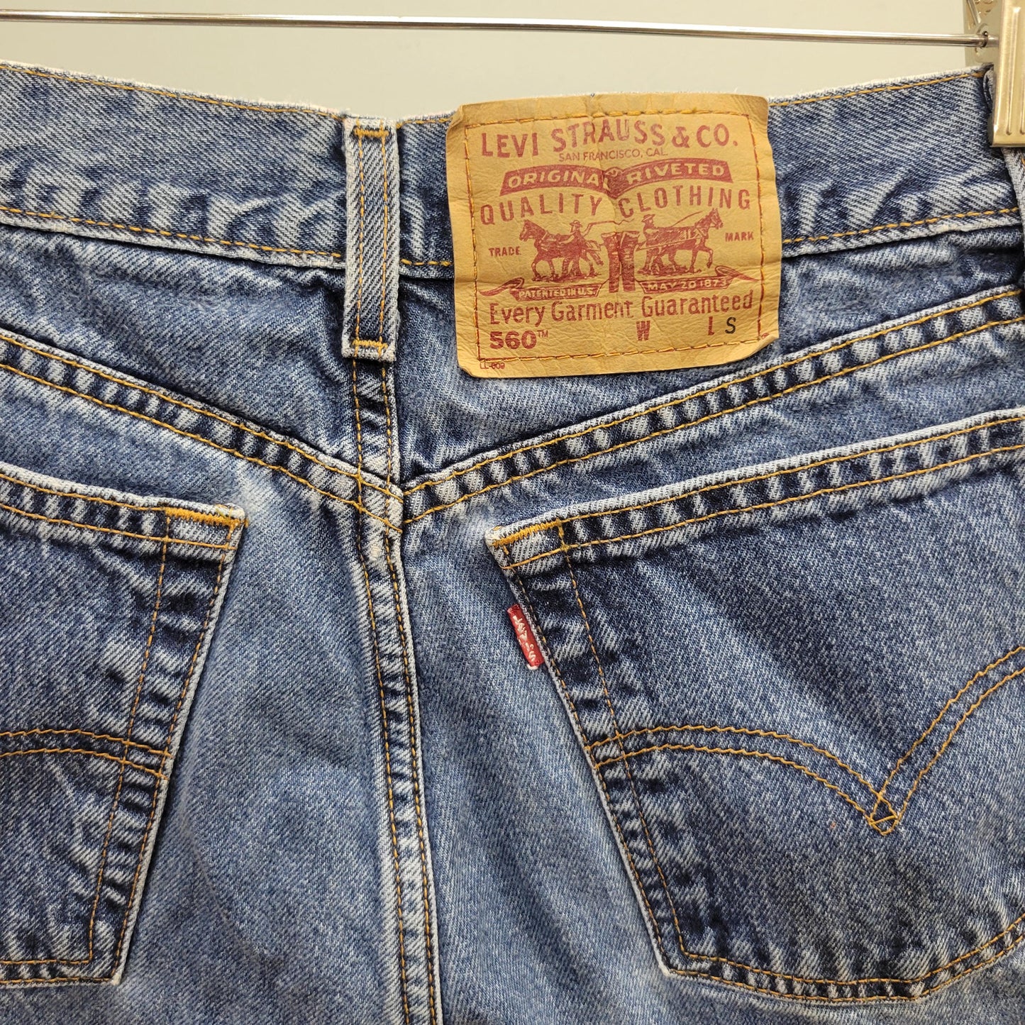 vtg 80s LEVI DENIM SHORTS // vintage 560 red tag regular loose fit jorts light medium stone wash paper tag denim jeans preppy casual